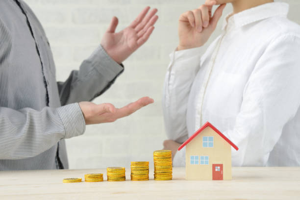 istock Man and woman talking about money and house problems 1186077431