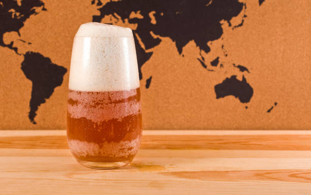 istock Glass of light beer on a map background 1186077628