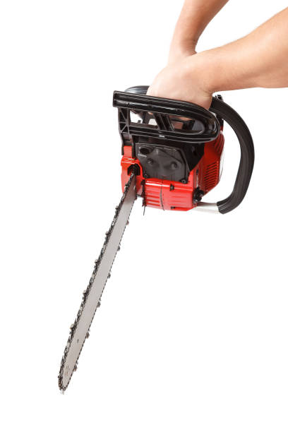 istock Chainsaw in a male hand isolated on a white background 1186077836
