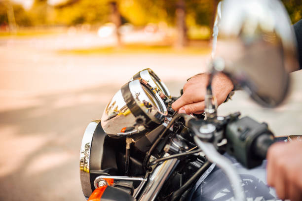 istock Inserting the key and starting the engine of a motorcycle, copy space. 1186078723