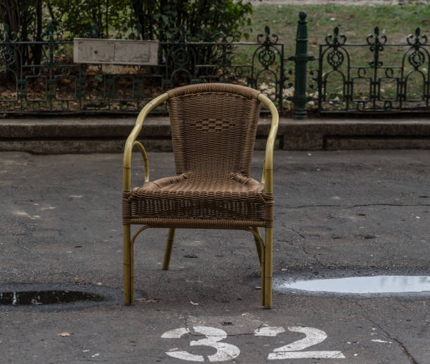 istock Wicker chair in car parking 1186078749