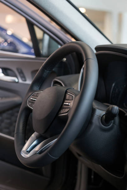 istock Interior and steering wheel of new modern car. 1186079171
