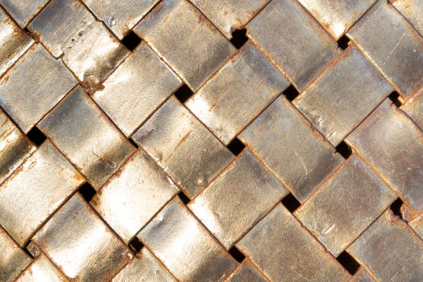 istock Rusty metallic stripes woven together, background concept. 1186079532
