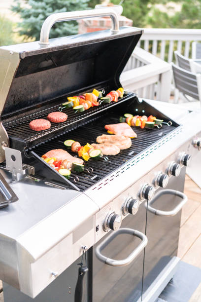 istock Grilling an Atlantic salmon, chicken breast, vegetable skewers 1186081287