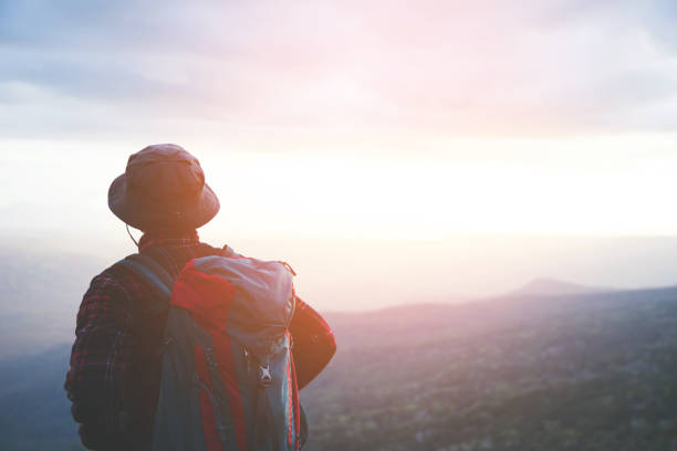 istock Tourists with hiking bags 1186082891