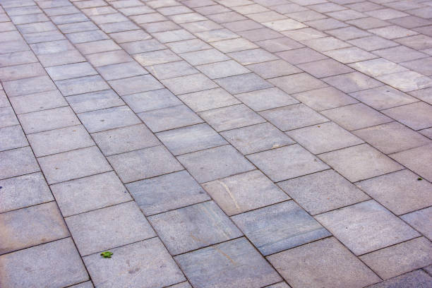 istock Grey brick pavement in the city in diagonal 1186083190