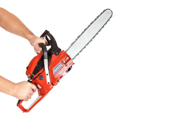 istock Chainsaw in a male hand isolated on a white background 1186083423
