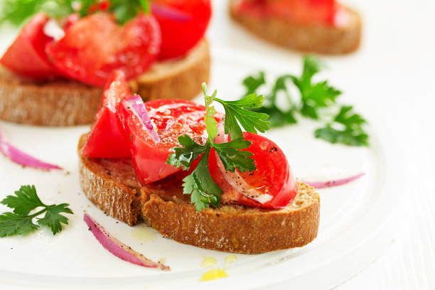 istock Bruschetta with tomatoes and onions. Selective focus 1186083562