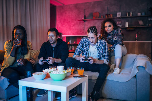istock People playing video games at home 1186084821