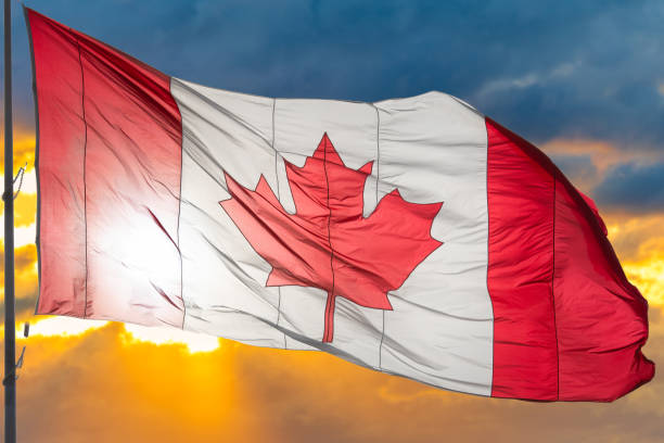 istock Canadian Flag Waving in Dramatic Sky 1186085579