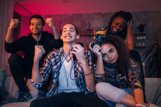 istock Young couple playing video games at home 1186085685