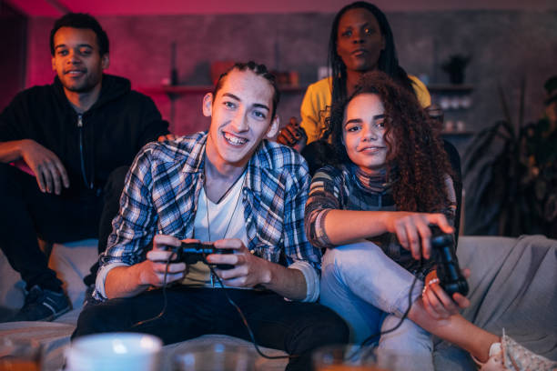 istock Couple playing video games at home 1186085719