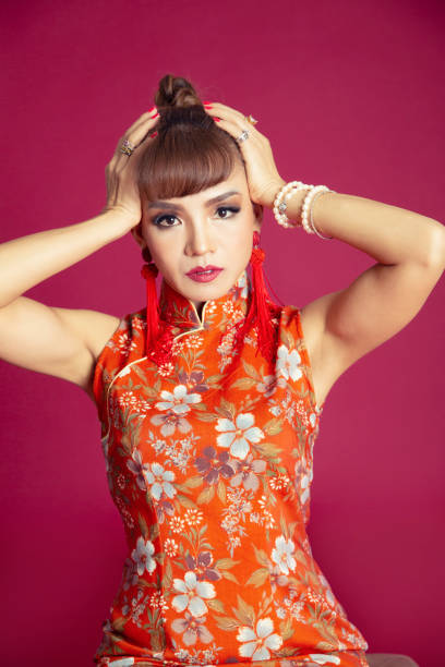 istock Chinese woman headache 1186088959