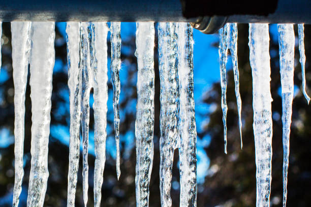 istock Winter or spring background with bright transparent icicles in the sunlight 1186089034