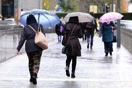 Brussels, Belgium. 7th November 2019.  Pedestrians walk during a rainfall.