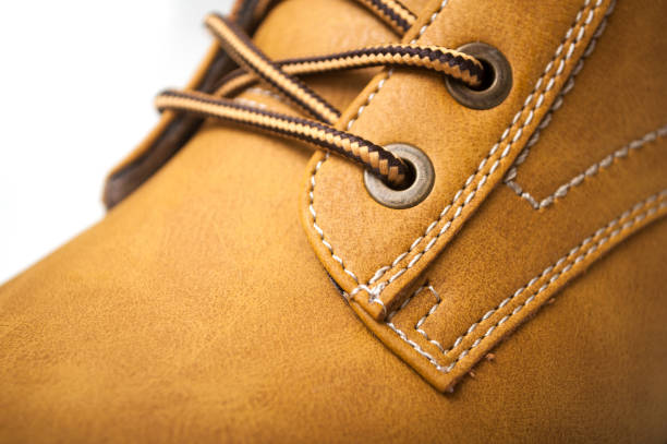 istock orange leather boots for men on white background 1186090712