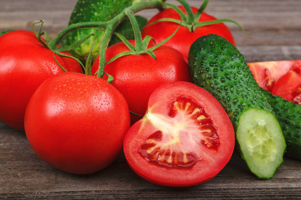 istock Fresh vegetables on a cutting board on a wooden background 1186090933