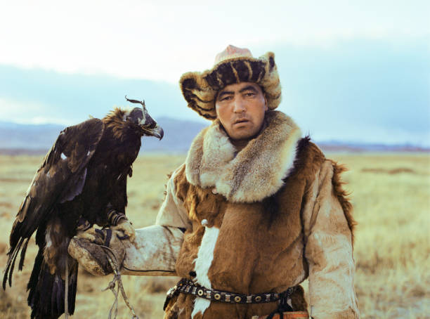 istock Portrait of eagle hunter standing in steppe in Mongolia 1186091154