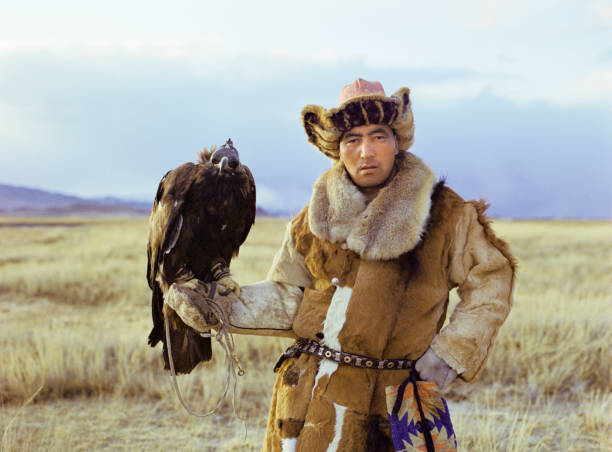 istock Portrait of eagle hunter standing in steppe in Mongolia 1186091155