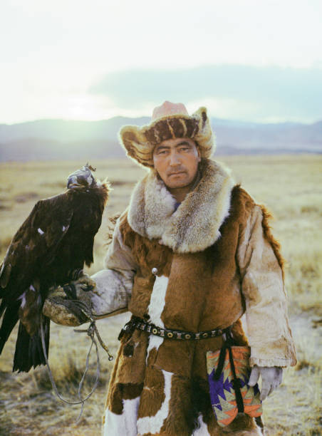 istock Portrait of eagle hunter standing in steppe in Mongolia 1186091185