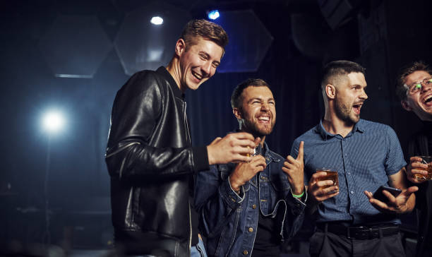 istock Weekend time spending. People have fun in the club. With alcohol in hands 1186092833