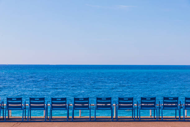 A view in Nice in Cote d Azur in France Nice cote d Azur. France. june 20 2019. A view of the beach Promenade des Anglaise in Nice in Cote d Azur in France d'azur stock pictures, royalty-free photos & images