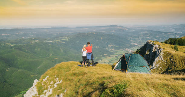 istock Couple looking at view while camping in mountains, Nanos. 1186093333