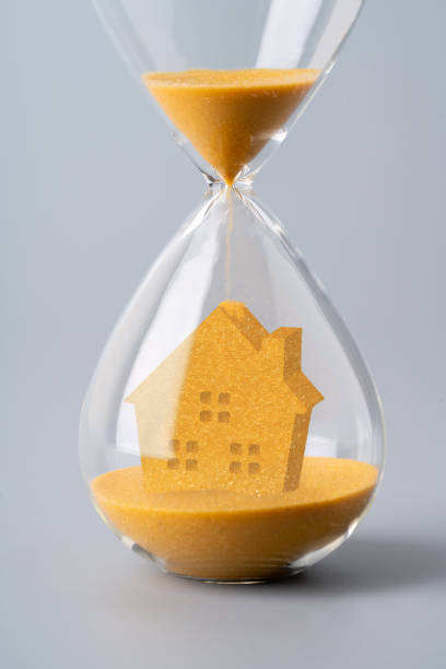 istock Sand clock for business concept and currency exchange 1186093520