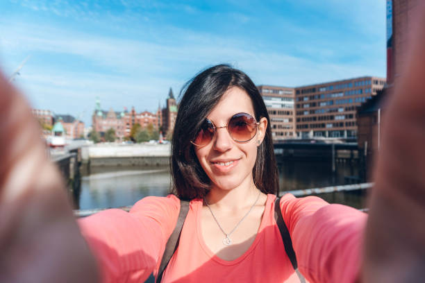 istock Tourist making selfies / vlogging in Hafen City 1186094512