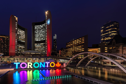 Toronto City Hall and Toronto Sign in downtown at night, in Toronto, Ontario, Canada