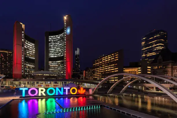 Toronto City Hall and Toronto Sign in downtown at night, in Toronto, Ontario, Canada