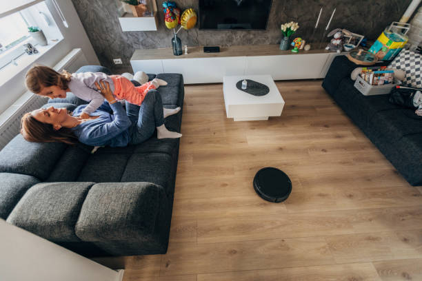 istock Family relaxing on sofa at home 1186099891