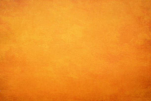 istock Orange yellow grunge old paper backgrounds.Rustic vintage surface texture. 1186099958