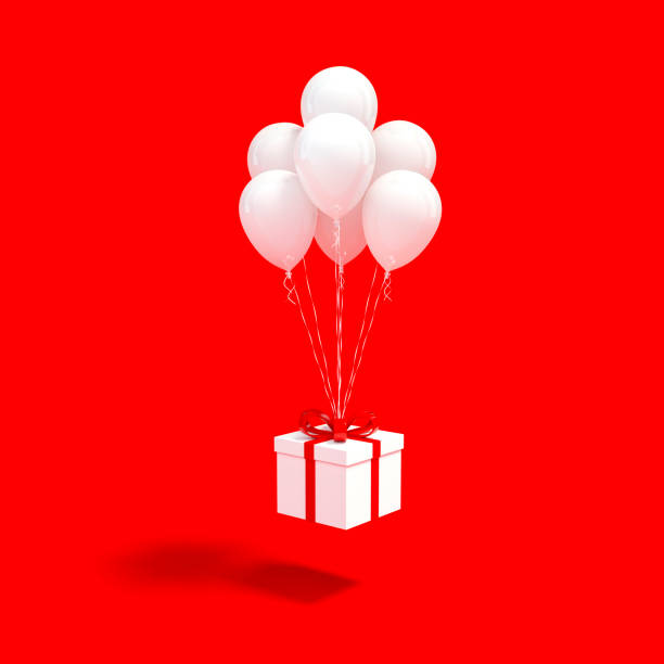 istock White gift box with red ribbon and white balloon floating on red background 3d rendering 1186099962