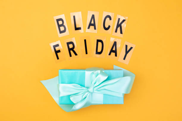 istock The inscription black friday and a gift with a bow mint color. 1186100665