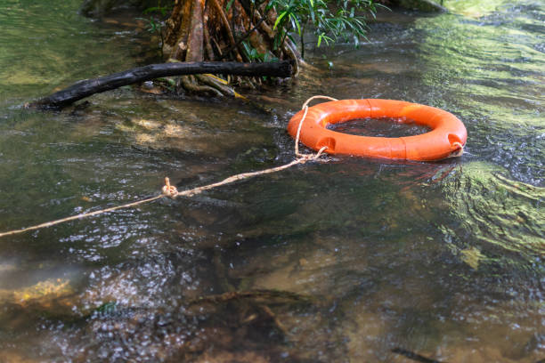 istock A orange lifebuoy at the waterfall 1186101595