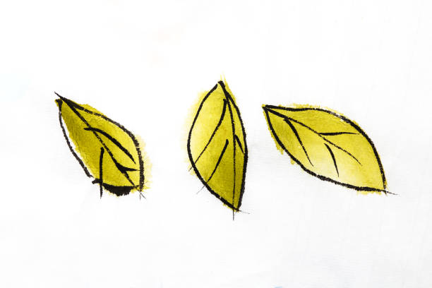 istock Light yellow leaves on rice paper touch 1186102184