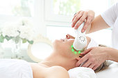 Light therapy ultrasonic facial massage.