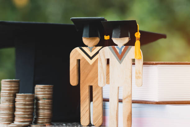 istock Idea investment for education learning scholaship financial fee,model people on textbook in university knowledge achievement for study abroad international,grant payments made to support student 1186104396