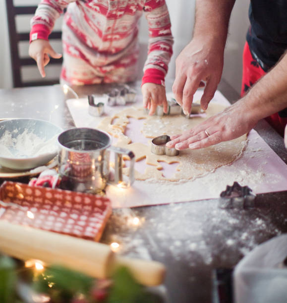 istock father and daughter making christmas cookies 1186104608