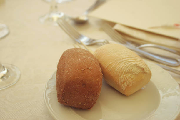 istock Close up detail of a dining table set up with bread 1186104906