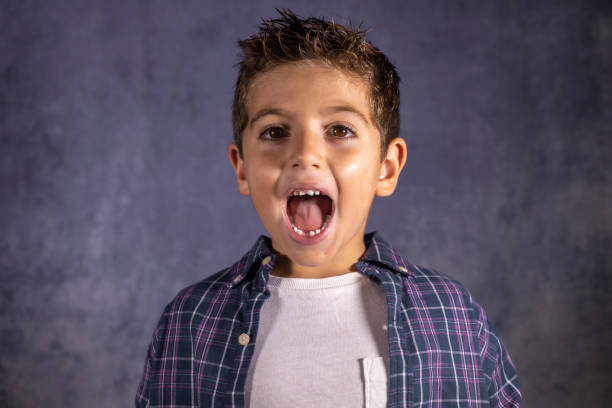 istock Surprised little child with open mouth and eyes 1186105255