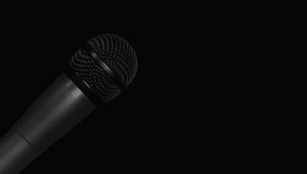 istock Studio microphone for recording voice over black background 1186109030