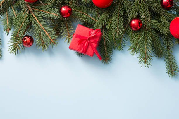 istock Christmas decoration with red gift box on blue wooden background, copy space 1186109425