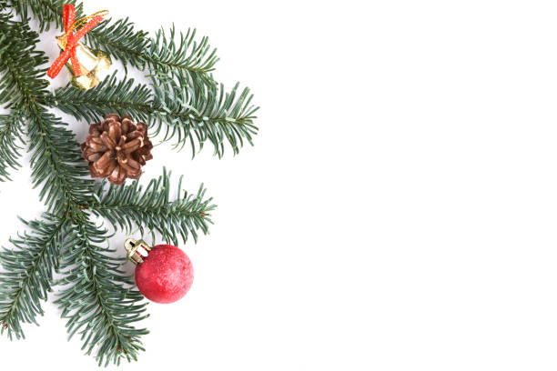 istock Christmas decorations and tree branch on white background. Red ball, golden bell and cone. Copy space. Flat lay. New Year and Christmas mood 1186109874