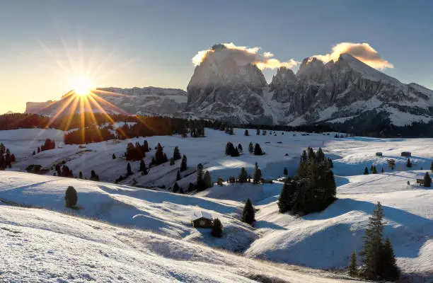 Picturesque sunrise panoramic view on Odle - Geisler mountain group, Seceda and Seiser Alm (Alpe di Siusi). Beautiful morning autumn scenery in the Dolomite Alps, South Tyrol, Italy.