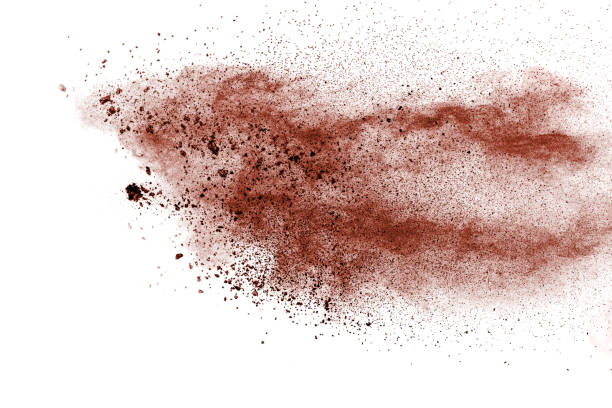istock Freeze motion of brown powder exploding. Abstract design of brown dust cloud against white background. 1186113953