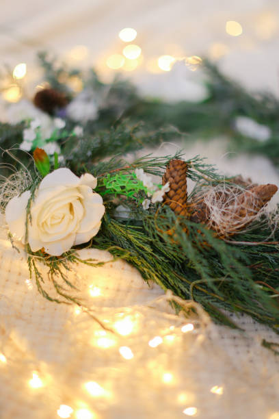 istock Green wreath and twinkling yellow garlands 1186114203