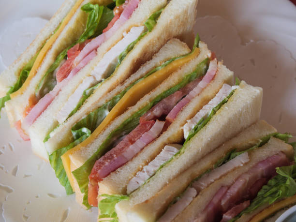 istock A delicious looking club sandwich on a white plate 1186118528