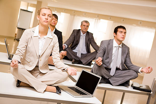 istock Meditating business partners 118611895